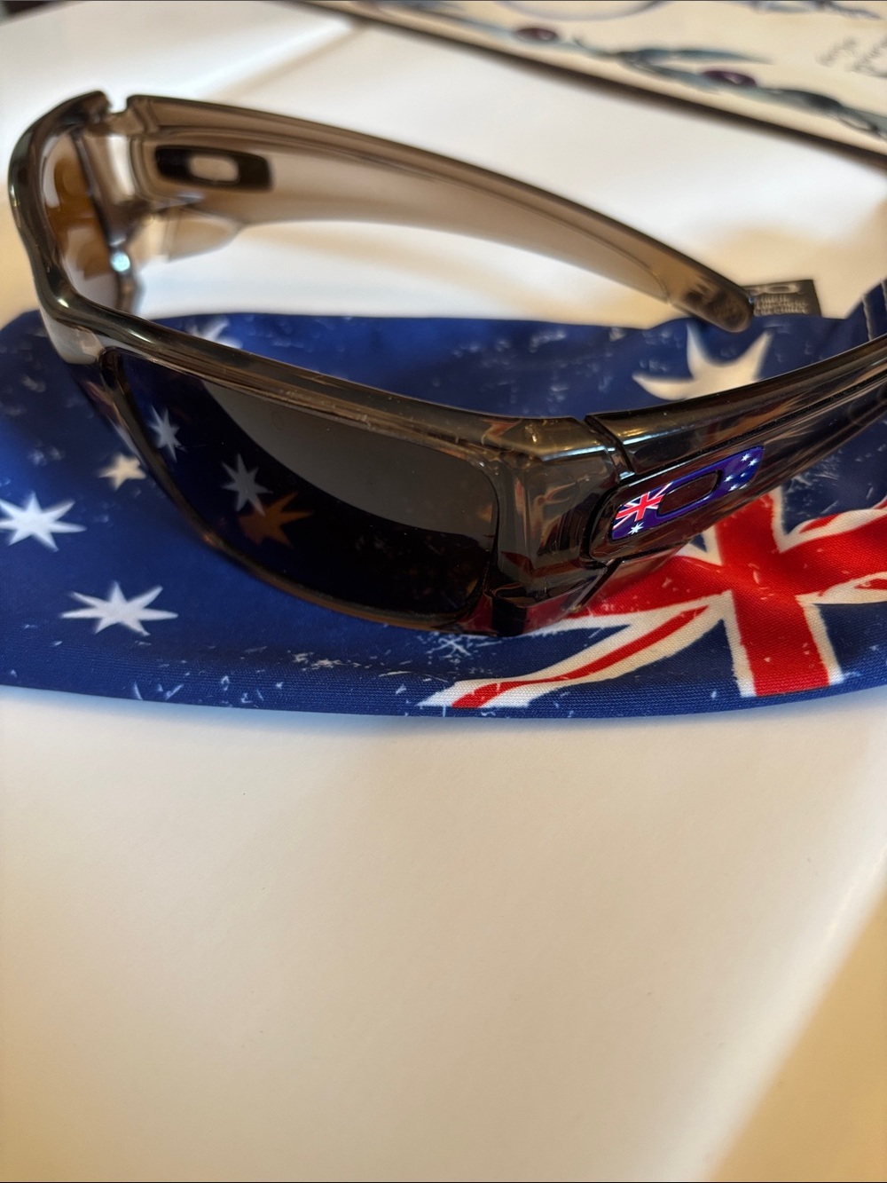 Oakley Smoky Gray Wrap Sunglasses with Australian Flag Accent